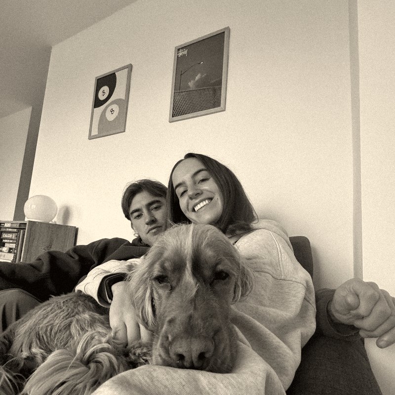 Levi and Billy on the sofa with their spaniel